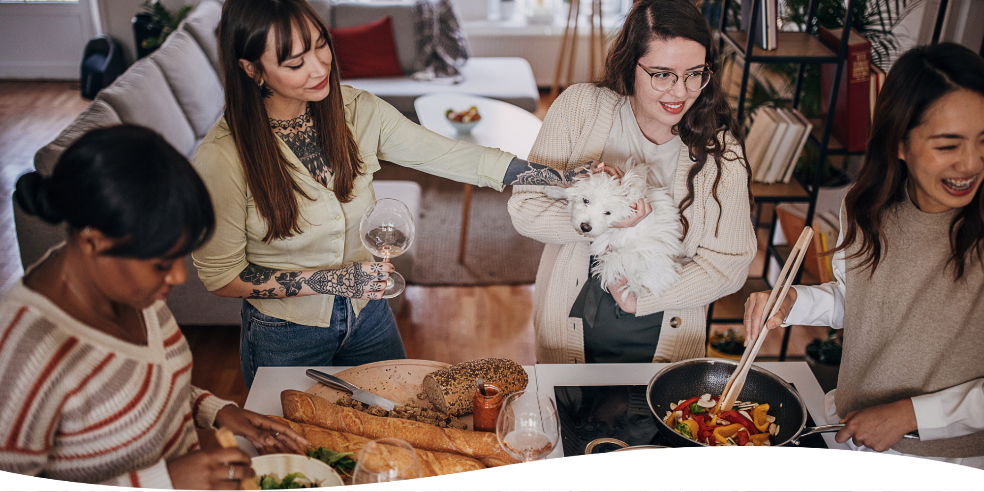 A group of roommates cooking dinner together. Renters Insurance and Roommates: Share and Save with Goodcover 