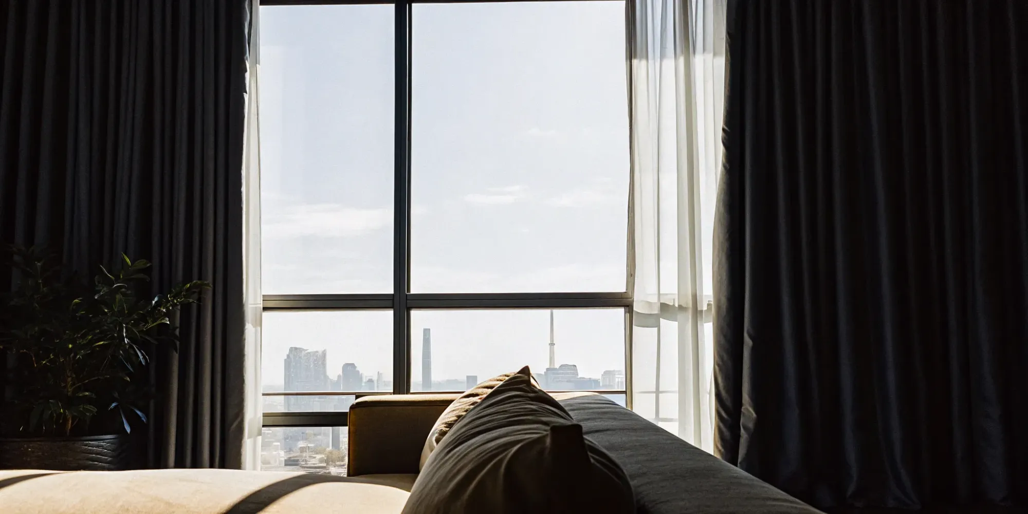 Dallas skyline view from apartment window. Renters insurance protects your belongings.