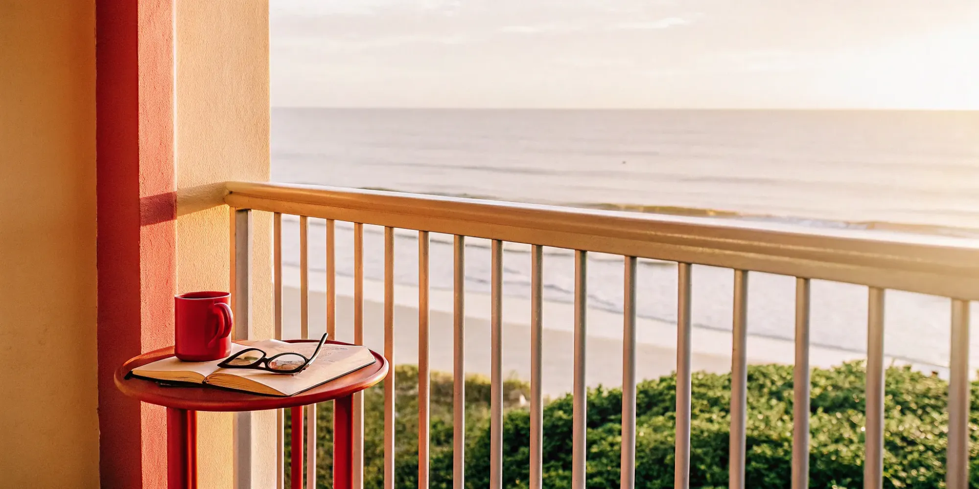 Florida renter's insurance protects belongings like a book and glasses on a balcony.